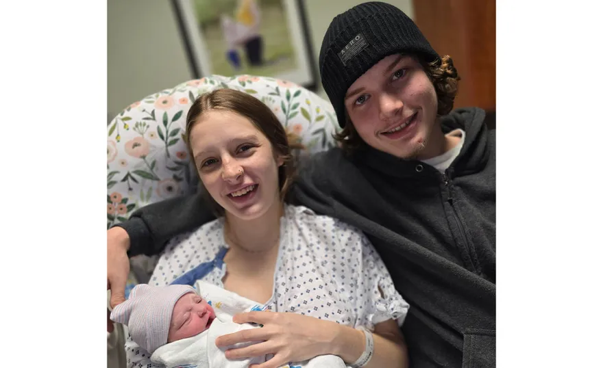 Baby girl Amelia Autumn Winston in the arms of her mother, Kathrine Teets, with father Ayden Winston.