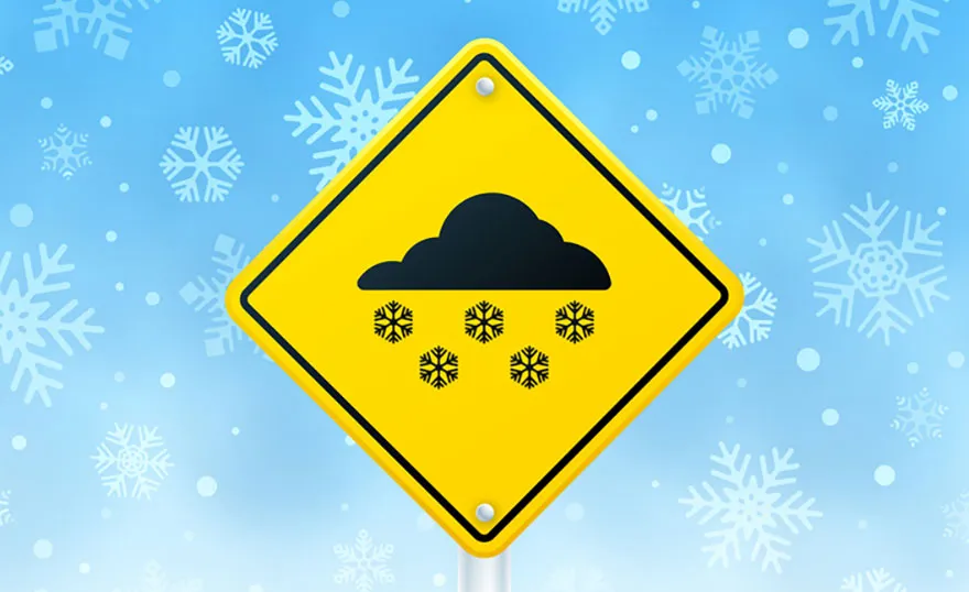 A graphic of a road sign for snow. A yellow sign with a black icon of a snowing cloud.