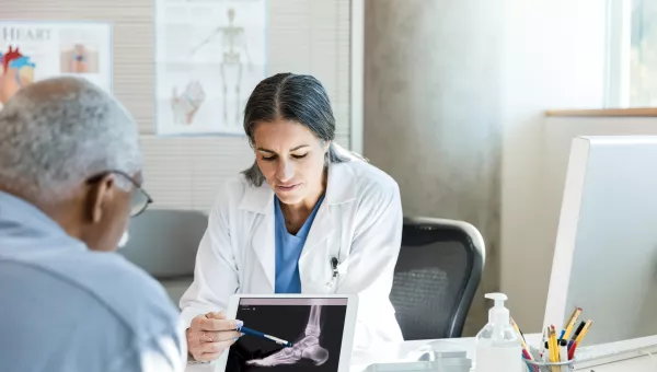 Doctor explaining podiatry options with patient