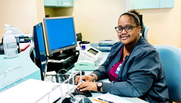 Support services working at a desk