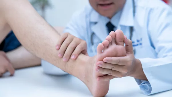 Podiatrist examing a person's foot