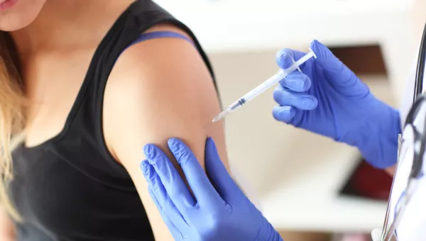 Nurse giving an allergy shot to a patient