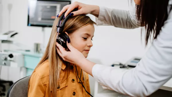 Girl having her hearing checked