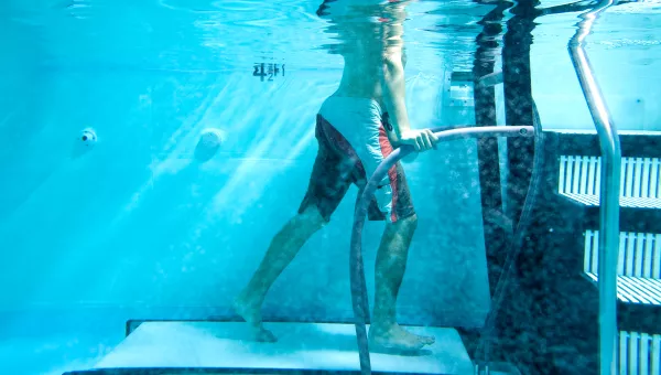 Man doing rehab in a pool